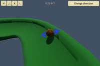 A screenshot of a game, with a brown scaly ball sitting on a green track.
            Directional arrows appear next the ball, while a timer and keyboard keys
            are shown at the top of the screen.